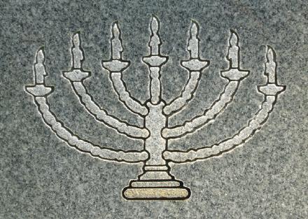 The menorah on a Jewish tombstone.